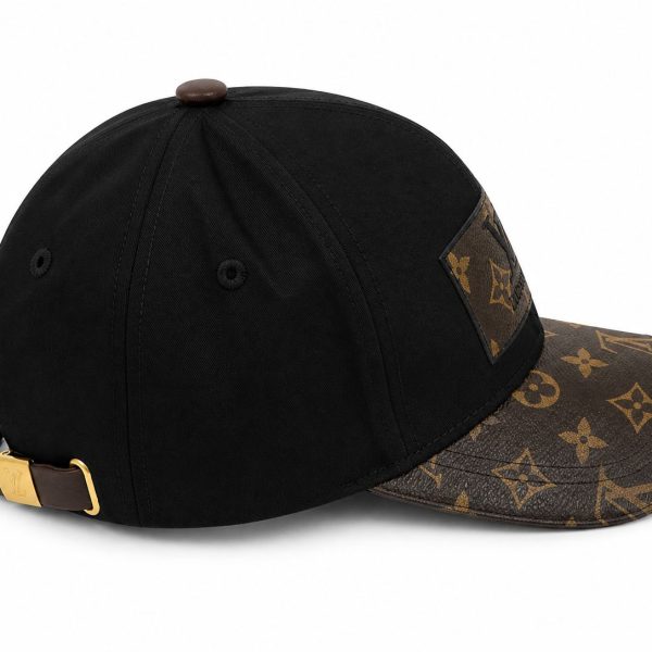 Black baseball cap with a brown LV monogrammed brim and adjustable strap at the back.