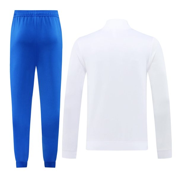 Blue athletic track pants paired with a white long-sleeve top, shown as a matching sportswear set.