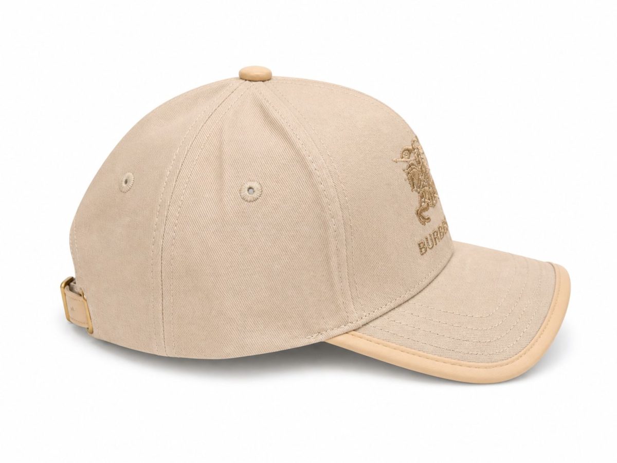 Beige Burberry baseball cap with an embroidered crest on the front and an adjustable strap at the back