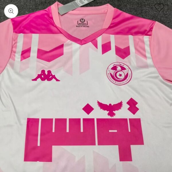 Pink and white football jersey with geometric pink patterns, Kappa logo on the left chest, and the Tunisian Football Federation crest on the right.