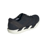 Dark navy athletic sneaker with a chunky white sole, viewed from the heel-side angle.