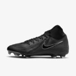 Black Nike soccer cleat with a white swoosh and textured detailing on a light background, highlighting the studded outsole.