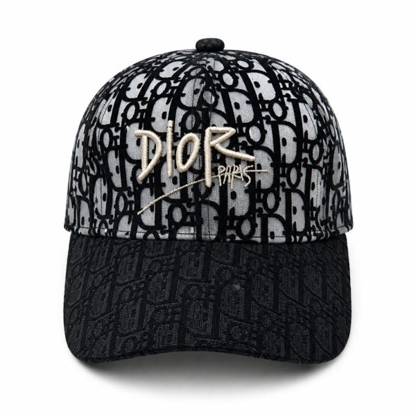 Dior baseball cap in black and gray with a repeating monogram pattern and gold 'DIOR PARIS' embroidery on the front crown.