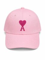 Pink baseball cap with embroidered heart and "A" for a stylish, love-themed accessory.