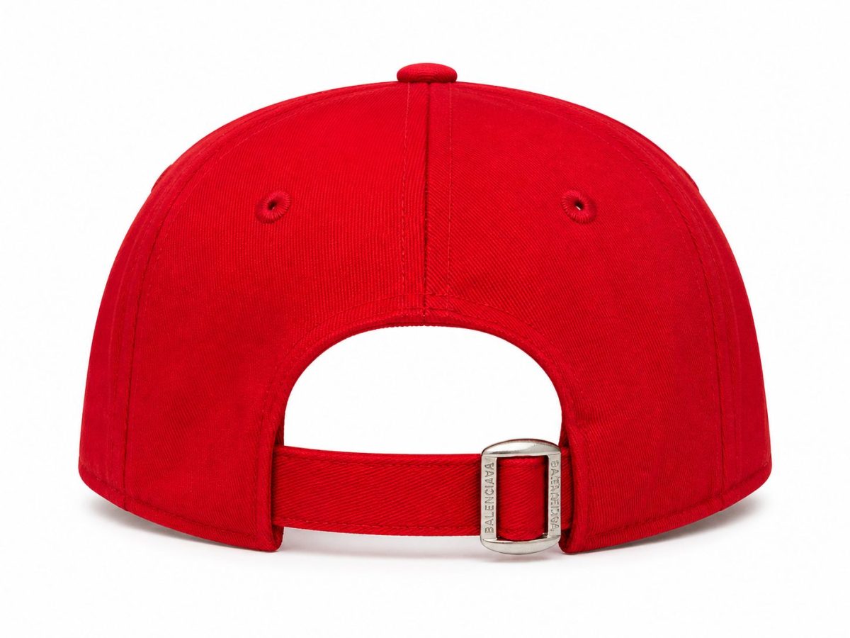 Rear view of a bright red cap with a metal buckle strap and adjustable opening at the back.