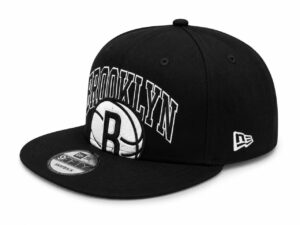 Black Brooklyn snapback cap with white embroidered lettering and a basketball patch on the front panel; New Era logo on the side.