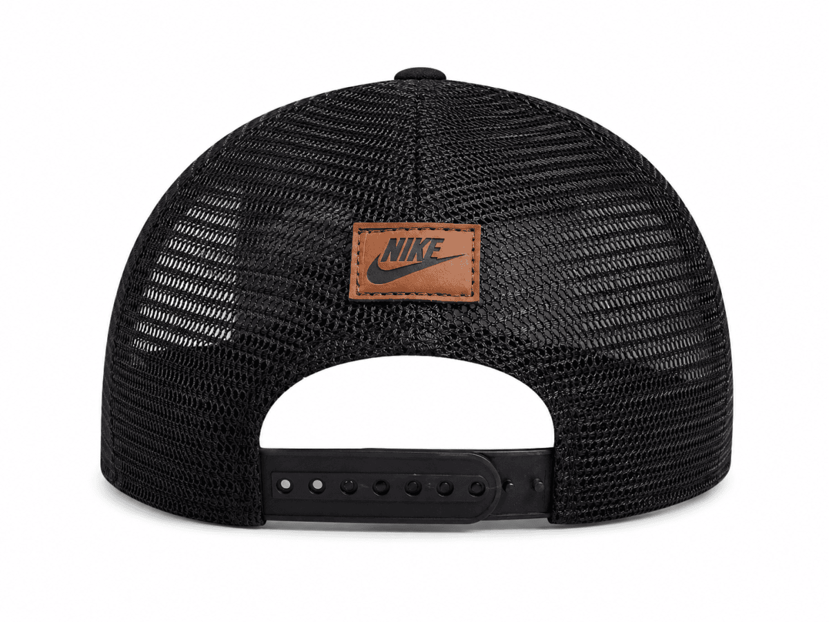 Rear view of a black mesh snapback cap with an orange-brown Nike patch on the center back panel and an adjustable plastic strap.