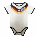 092f44c6-3285-4253-9b5c-4848f34f74ca | UAE SPORT STORE White baby onesie with black trim and German flag chevrons across the chest, and a circular German football badge.