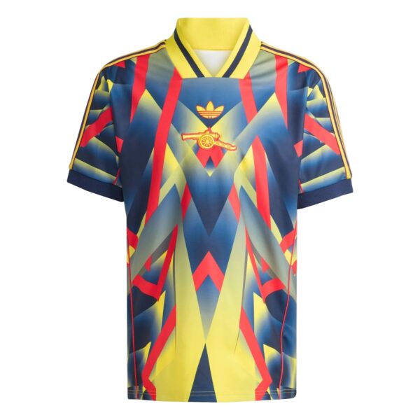 Colorful geometric-pattern sports jersey with a yellow collar and a small gold emblem on the chest.