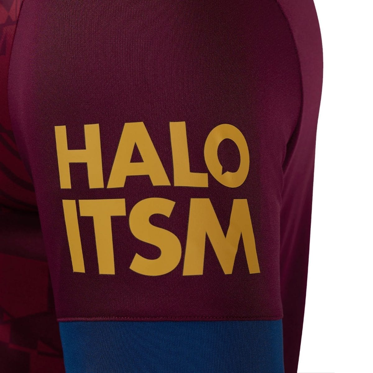 Close-up of a maroon jersey sleeve with large yellow text reading 'HALO TSM'.