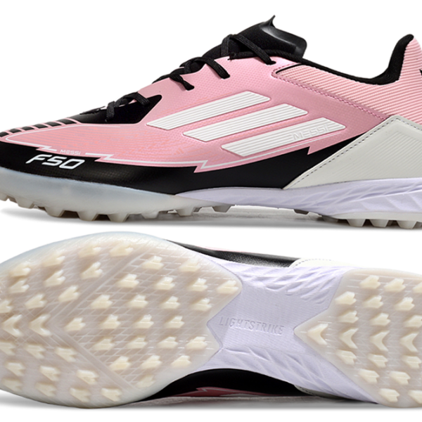 Pink Adidas Messi F50 turf soccer shoe with white stripes and black toe, side view showing studded outsole and white midsole