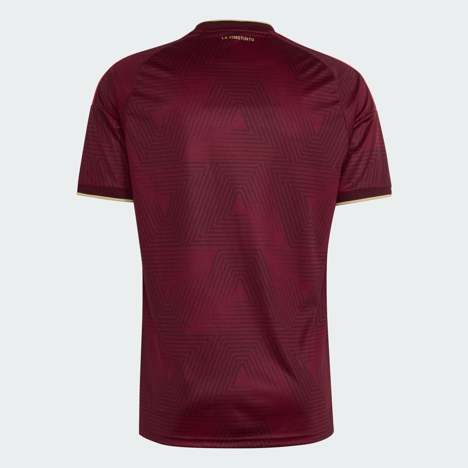 0c71981d-af45-4b27-b90e-c4274df8c0ab | UAE SPORT STORE Back view of a maroon soccer jersey with geometric pattern and gold collar trim, small 'LA VINOTINTO' text at neck.