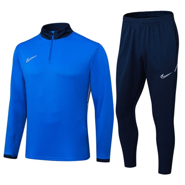 Blue Nike long-sleeve athletic top with a zip-neck next to navy jogger pants with a white swoosh logo.