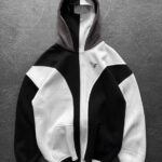 Black and white color-block hoodie with a full front zipper and two front pockets