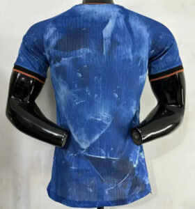 0e6a2164eae2131f | UAE SPORT STORE Back view of a blue athletic shirt with water stain patterns on a mannequin torso.