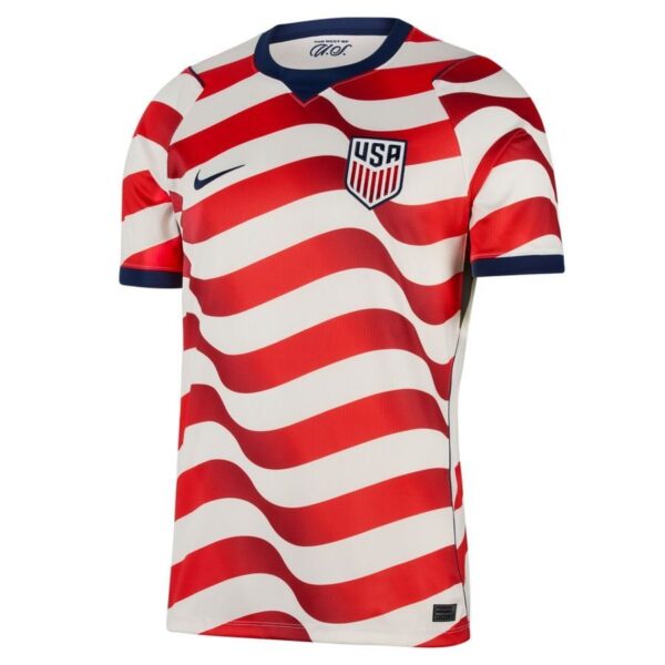 Front view of a USA soccer jersey with bold red and white wavy stripes, navy collar, and team crest on the chest.