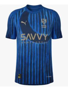 Front view of a blue striped soccer jersey with gold 'SAVVY' sponsor and Club crest on the chest, Puma logo on the opposite side.