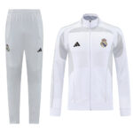 White Real Madrid tracksuit: zip-up jacket with club crest and matching light-gray pants.