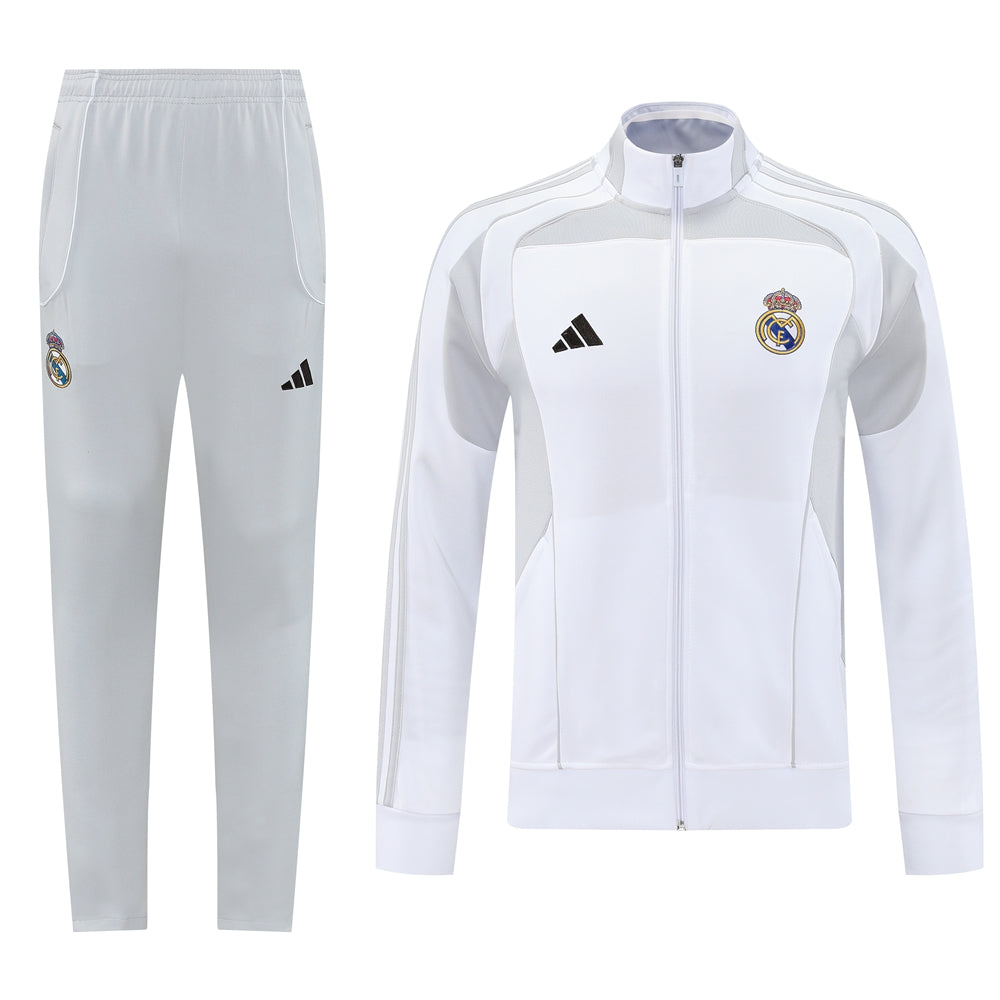 0f340867_5b634459-b32e-40f4-a5fc-d71befba4cb7 White Real Madrid tracksuit: zip-up jacket with club crest and matching light-gray pants.