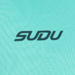 Close-up of turquoise fabric with a dark teal 'SUDU' logo centered.