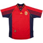 Red Spain national team soccer jersey with navy side panels, crest, and Adidas logo.