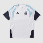 White Argentina national team jersey with light blue panels, navy sleeves, and Adidas logo.