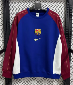 112 | UAE SPORT STORE Blue FC Barcelona Nike pullover with maroon sleeves, white side panels, gold swoosh, and team crest on the chest.