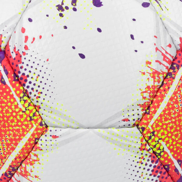 Close-up of a quilted fabric with a bold abstract pattern in red, pink, purple, and yellow splatters.