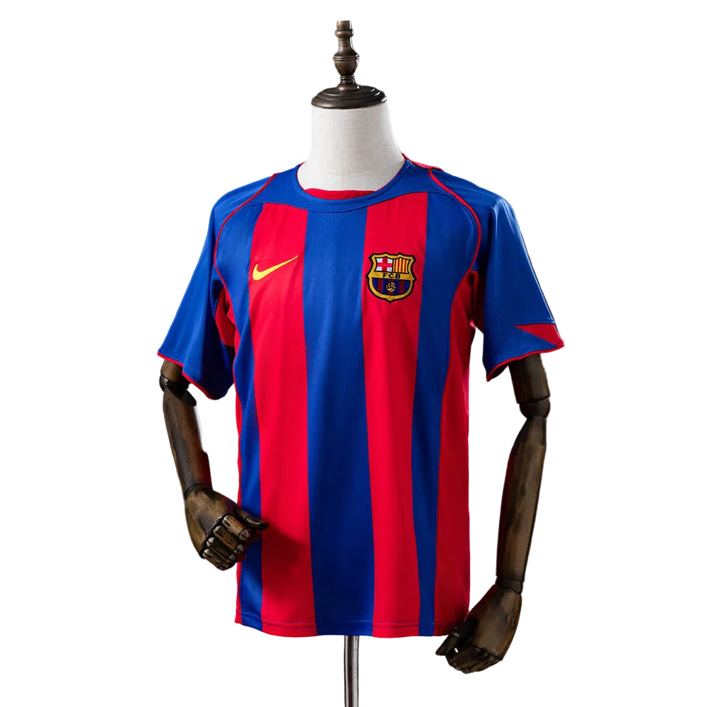 1176bbb1 | UAE SPORT STORE FC Barcelona home soccer jersey on a mannequin, blue and red vertical stripes with Nike logo and club crest on the chest.