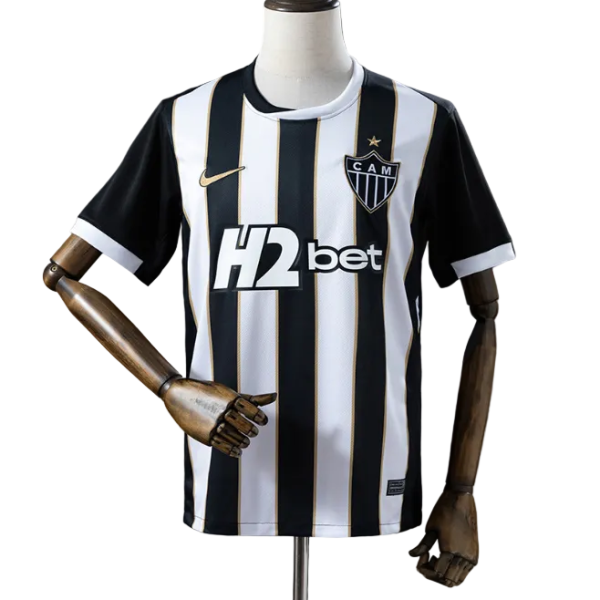 Black and white striped football jersey on a mannequin, CAM club crest on chest, H2bet sponsor across the front.