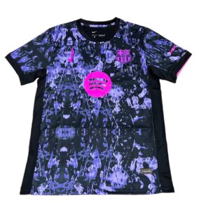126a5f12 | UAE SPORT STORE Black and purple camouflage FC Barcelona jersey featuring a pink Spotify sponsor logo and pink crest, with a Nike swoosh.
