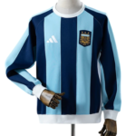 Argentina national soccer jersey on a mannequin, blue and light blue vertical stripes with AFA crest and Adidas logo.