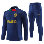 Portugal national team navy blue training top with crest, SAGRES sponsor, and yellow Nike logo, shown with matching blue pants.