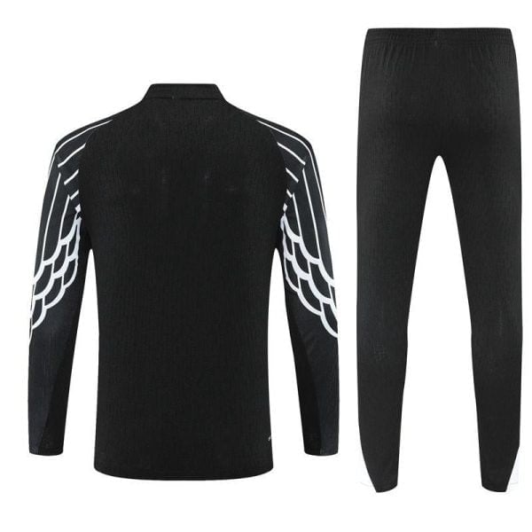Black athletic tracksuit jacket and pants set with white wing-like stripes along the sleeves, viewed from the back.