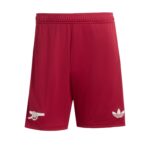 Red athletic shorts with an elastic waistband, featuring a white Arsenal cannon logo on the left leg and Adidas trefoil on the right leg.