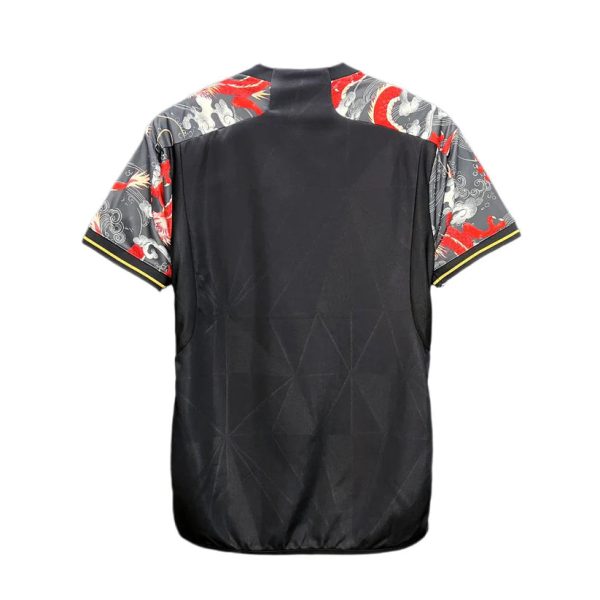 Back view of a black athletic jersey with patterned dragon-themed sleeves in gray and red.
