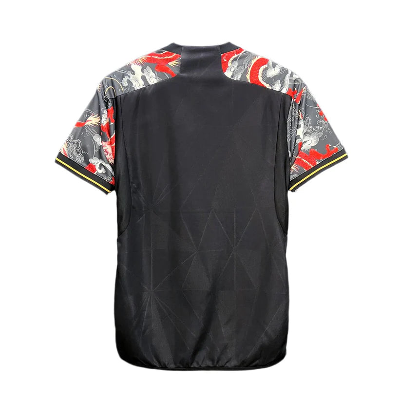 13be8125-5add-46e7-9323-89858de60280 | UAE SPORT STORE Back view of a black athletic jersey with patterned dragon-themed sleeves in gray and red.