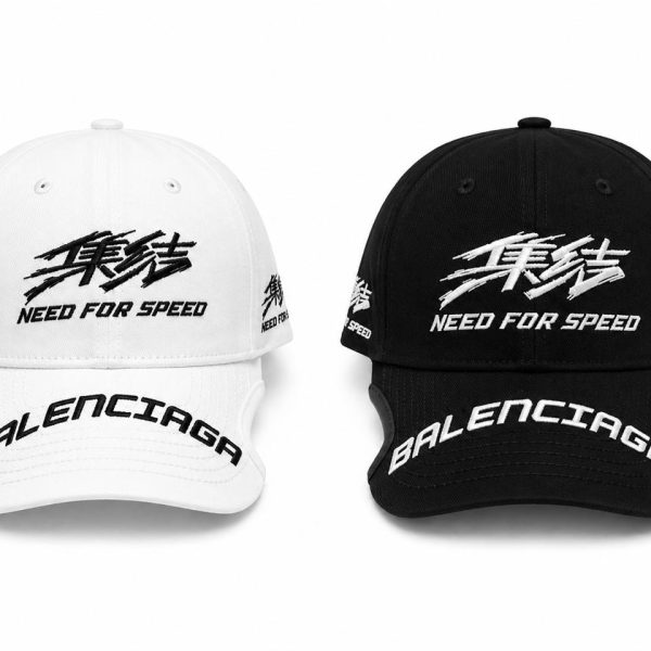 White and black Balenciaga baseball caps, front embroidery reads 'Need for Speed' with 'BALENCIAGA' on the brims.
