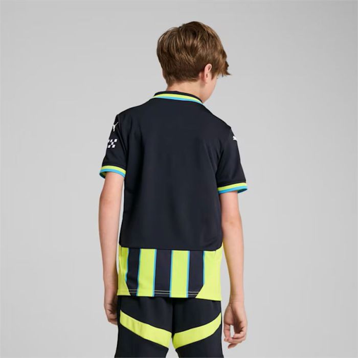 141141-2 | UAE SPORT STORE Back view of a child wearing a navy polo with lime and blue striped hem, paired with neon yellow-and-blue striped shorts
