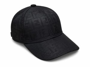 Black baseball cap with a subtle textured monogram pattern on a white background, front-right view.