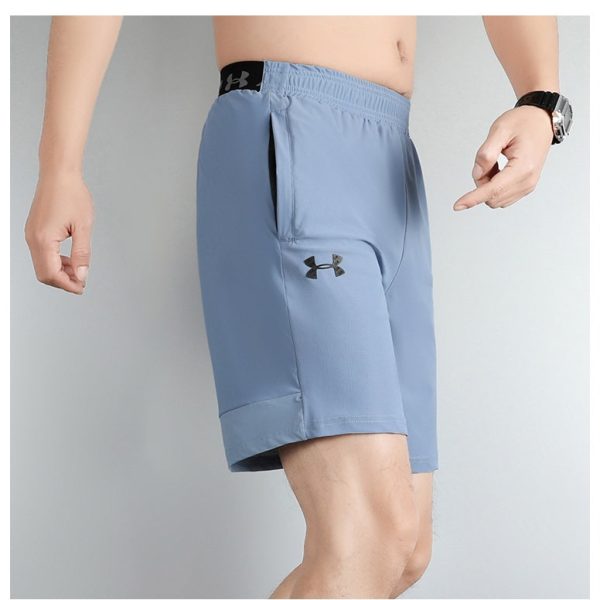 Light blue men's athletic shorts with Under Armour logo on the thigh and a side pocket.