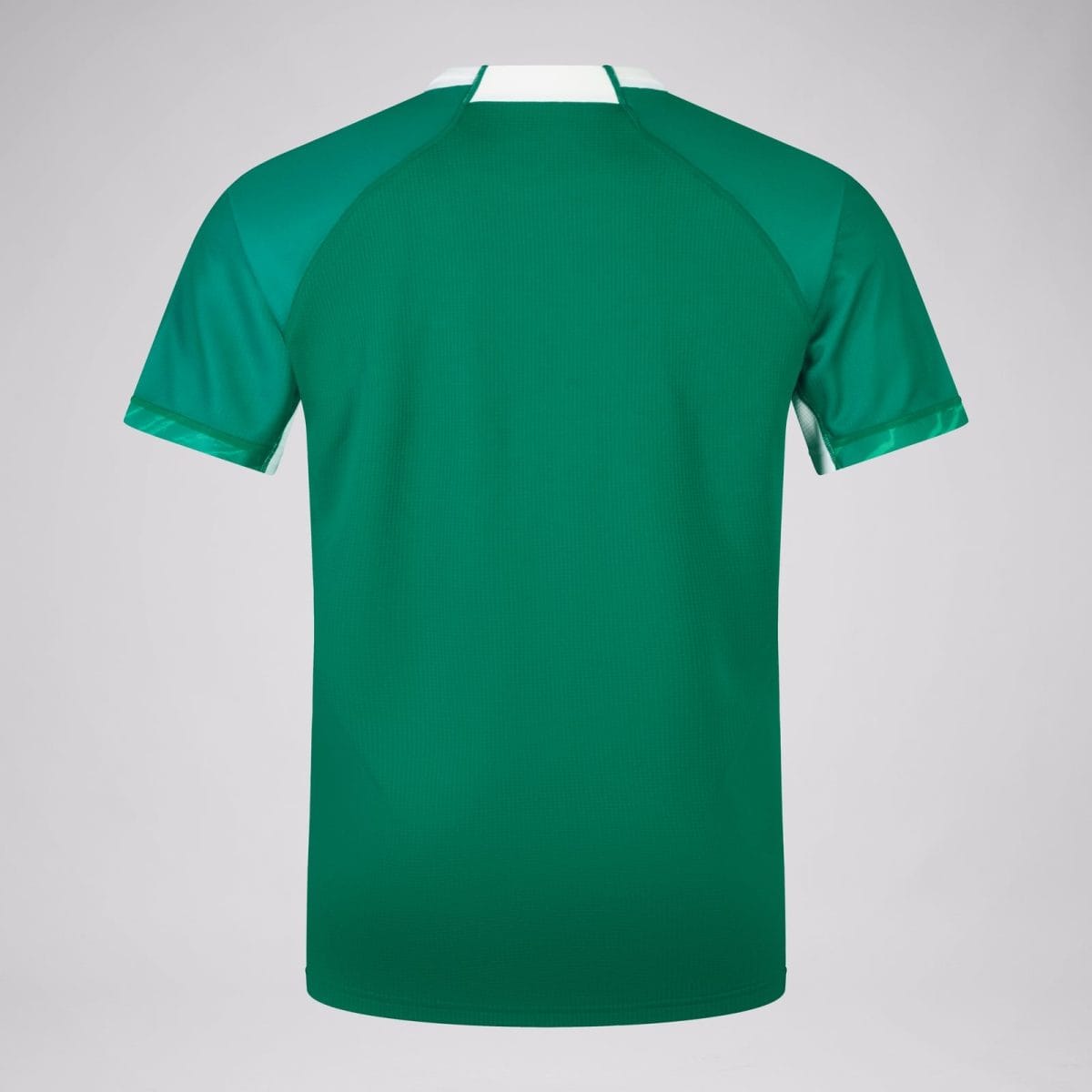 Back view of a green polo shirt with a white collar and teal sleeve panels, plain gray background