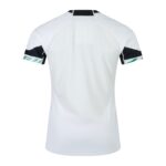 Back view of a white athletic jersey with a large mesh back panel and black armband accents on the sleeves.