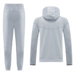 Light gray athletic tracksuit with a hooded sweatshirt and jogger pants displayed flat; back view of the hoodie shown.