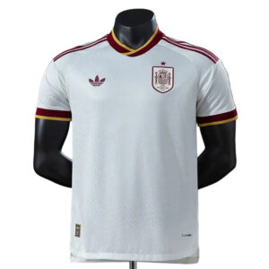 White Spain national team football jersey with crest on the left chest, Adidas logo on the right, and red-gold trim.