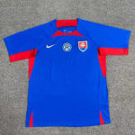 Blue Slovakia national soccer jersey with red accents and Nike logo laid flat on a gray surface.