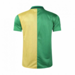 Back view of a two-tone polo/jersey with yellow on the left half and green on the right half, split vertically down the center.