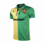 Soccer jersey split green and yellow with club crest on left chest, Umbro logo on right, and SHARP sponsor across front.