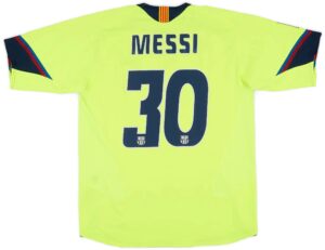 16152977e336087cdf33316bb93ca345c57a0c4446d54b34355e53a6ccf2b393 | UAE SPORT STORE Bright neon yellow soccer jersey back: name 'MESSI' and large number 10 with small Barcelona crests at the bottom.