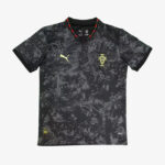 Portugal national football team jersey: black camo-pattern shirt with red/green trim at the collar, crest on the left chest, and yellow Puma logo.